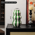 Modern niche minimalist striped vases, flower arrangements in them, high-end sense, creative retro painted ceramic vases
